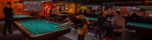 Play pool, shuffleboard and darts at Atomic